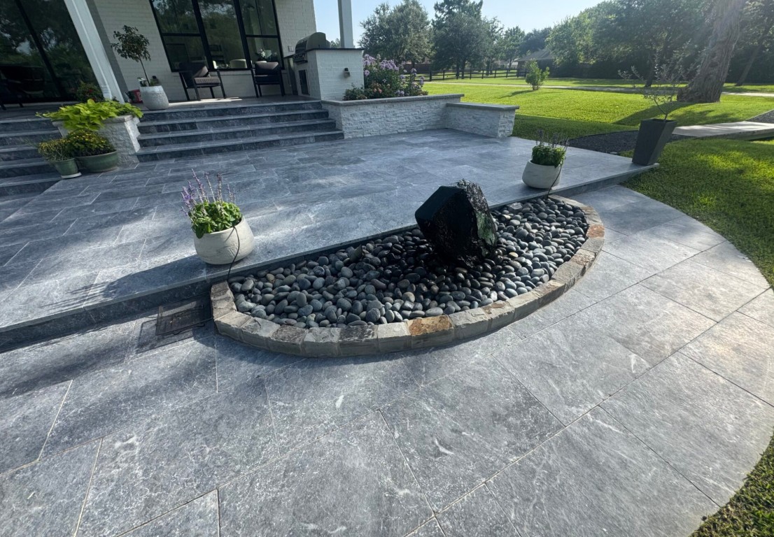 Modern decorative concrete patio with water feature