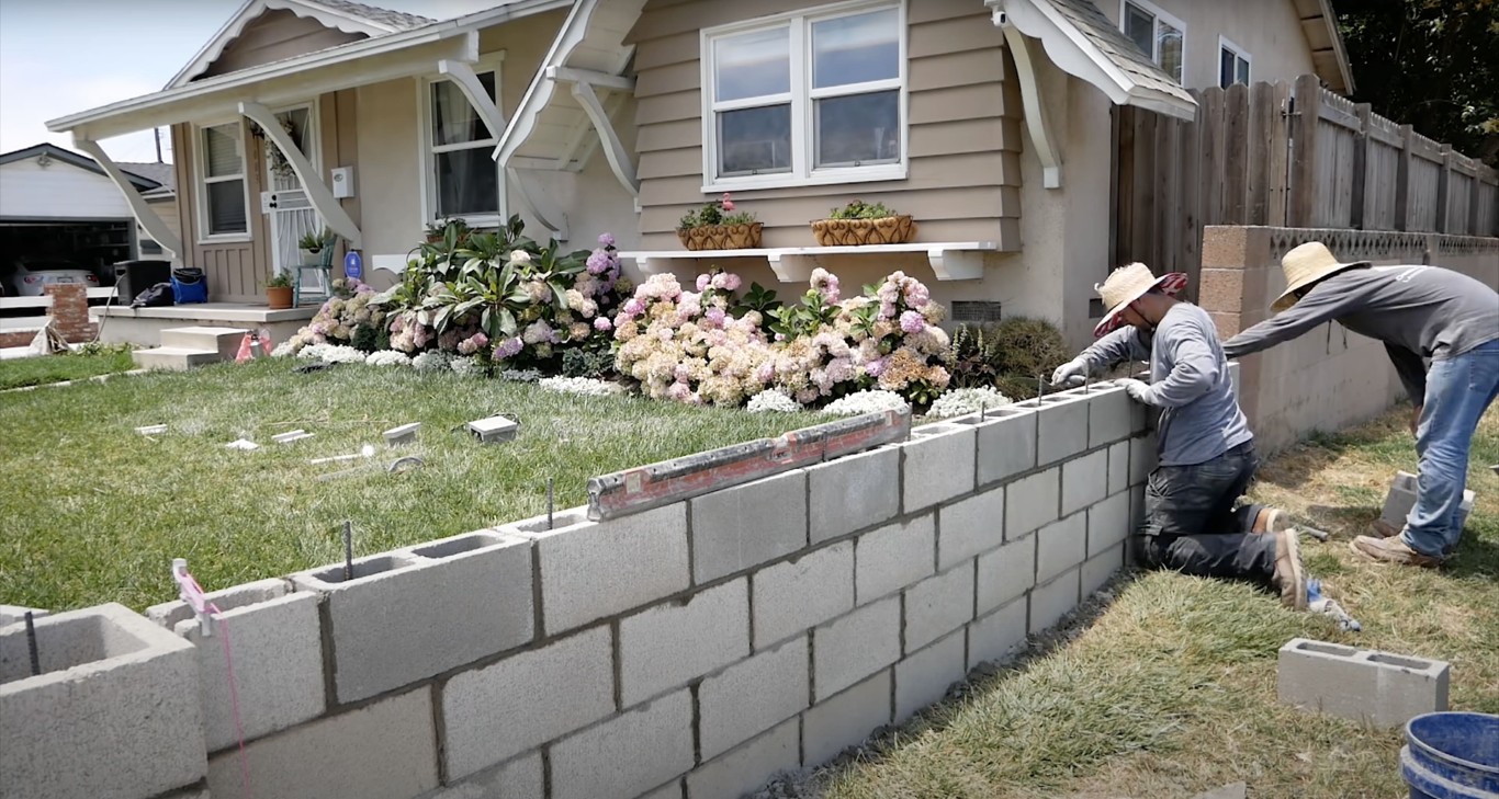 Retaining wall and concrete masonry construction